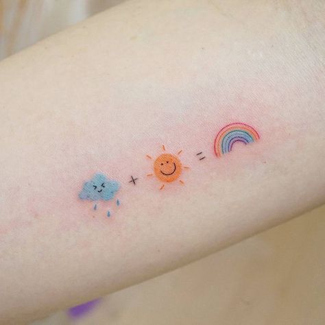 Rain + sun = rainbow tattoo on the inner forearm. Cute Rain Tattoos, Cute Rain Cloud Tattoo, Rainbow Aesthetic Tattoo, Sun Tattoo In Color, Rainbow Colored Tattoo, Rainbow Rain Tattoo, Rain And Rainbow Tattoo, Happy Small Tattoos, Tattoo Ideas Rainbow