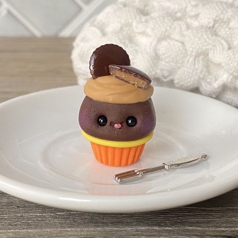 "This peanut butter cup cupcake charm was lovingly hand made from polymer clay by artist Esther Martinjak just for you.     Charm can be a tiny figurine or can have a gold lobster clasp added so it can hang from your wristlet, day planner, purse, charm bracelet, or book bag.   Approximately 1\" by 1\" or around the size of a quarter coin.  NOTE:  -Not recommended for children under 6 years. Choking Hazard! -Each item is handmade and may have slight variations from the photographs." Clay Muffin, Clown Cupcakes, Elephant Cupcakes, Bear Cupcakes, Bunny Cupcakes, Cupcake Charms, Peanut Butter Cup, Day Planner, Cute Polymer Clay