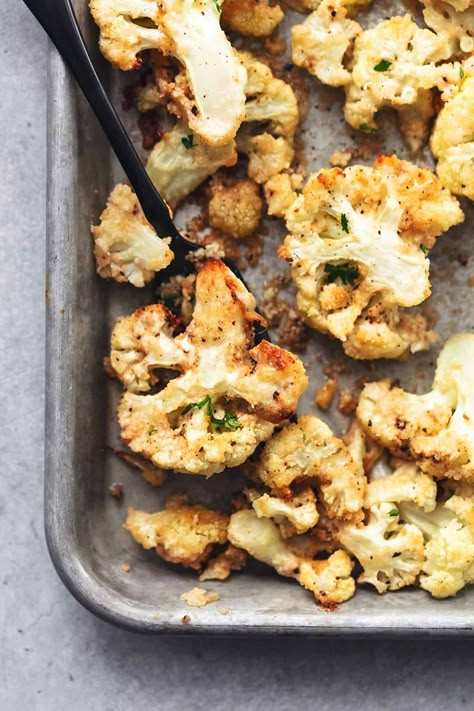 The easiest (and the only) oven Roasted Cauliflower recipe you'll ever need! So crispy, garlicky, and cheesy, and done in just 20 minutes!