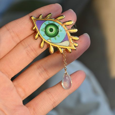 A beautiful enamel pin featuring a dragon's tear. Perfect for any fan of dragons or mythology. #dragon #enamelpin . #Zelda_Accessories #Zelda_Merch #Enamel_Pin_Design #Light_Dragon Legend Of Zelda Jewelry, Zelda Dragon, Enamel Pin Design, Light Dragon, Botw Zelda, Tears Of The Kingdom, Left Eye, Pin Design, Screen Color