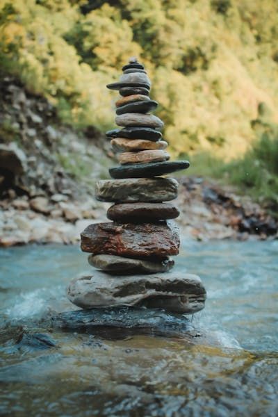 Stacked Rocks in Close-up Photography · Free Stock Photo Rock Stacking, Stacking Rocks, Stacked Rocks, Stacked Stones, Flowing River, Rock Photography, Close Up Photography, Stacked Stone, Lush Greenery