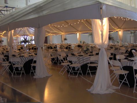 Tents can be set up inside to define a space--such as this wedding reception held inside a church gymnasium. Diy Chandelier Wedding Receptions, Wedding In A Gymnasium, Gymnasium Wedding Reception, Gymnasium Decorations, Church Wedding Reception Decorations, Gym Wedding Reception Decoration, Church Gym Wedding Reception, Church Reception Decorations, Cultural Hall Wedding Reception