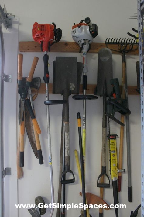 Utilize wall space to hang yard tools. Hanging Tools On Wall, Hang Weedeater In Garage, Hanging Garden Tools On Fence, Hanging Yard Tools In Garage, Hang Garden Tools On Wall, Hang Yard Tools In Garage, Pallet Yard Tool Organizer, Lawn Tool Storage, Lofted Cabin