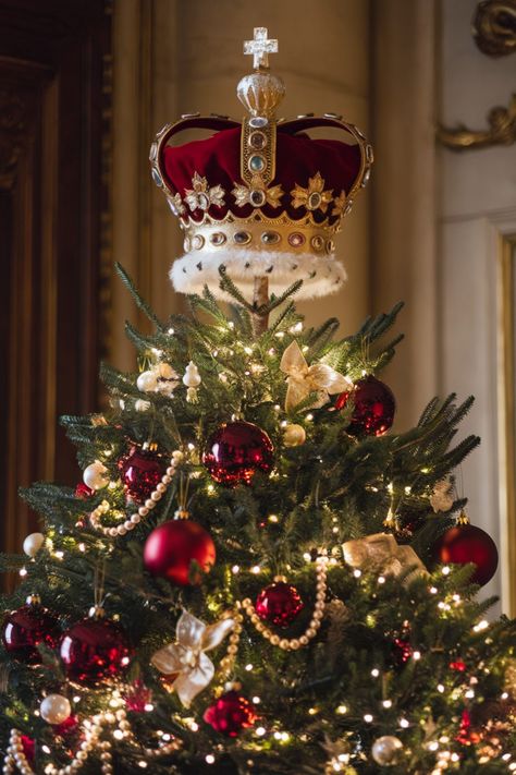 A regal Christmas tree topper idea featuring an ornate crown adorned with jewels and gold detailing, placed atop a tree decorated with red and gold ornaments, pearls, and warm lights for an elegant, royal holiday look. Elaborate Christmas Trees, Gold Poinsettia Christmas Tree, Fancy Christmas Tree Decorations, Crown Christmas Tree Topper, Luxury Christmas Trees, Music Inspired Christmas Tree, Cardinal Christmas Tree Ideas, Large Ornaments On Tree, Unique Christmas Tree Toppers