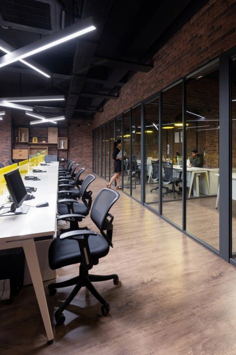 Even the stereotypically functional open office has been treated with a statement ceiling design that gives the space character and the colour ‘yellow’ that creates interest in the working surfaces. Workspace Design Office, Exposed Ceiling, Exposed Ceilings, Brick Cladding, Office Space Design, Collaboration Space, Open Office, Workspace Design, Backyard Garden Design