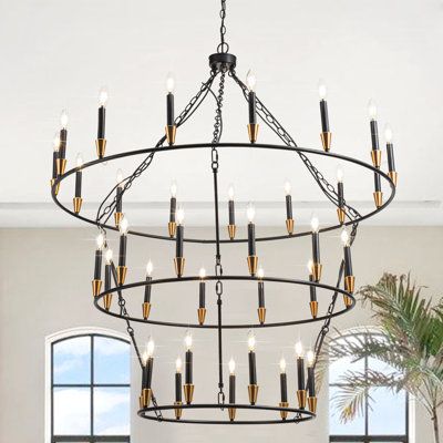 Extra larger 3 tier wagon wheel chandelier. The grand three-decker black foyer chandelier, one of the large chandeliers for high ceilings, is truly a breathtaking piece! The round chandelier matte black finish and striking carriage wheel frame make it a statement in any room. With a diameter of 47.24 inches and 36 lights, it provides ample lighting coverage, ensuring a well-lit room. This chandelier with bright lights is create a cozy and inviting atmosphere, perfect for enhancing the farmhouse- Chandeliers For Vaulted Ceilings, Cathedral Ceiling Lighting, Oversized Black Chandelier, Large Chandelier High Ceilings, Wagon Wheeel Chandelier, Chandelier High Ceiling Under $500, 2 Tier Wagon Wheel Chandelier, Wagon Wheel Chandelier Black, Large Entryway