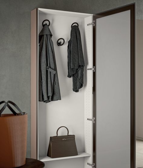 Welcome mirror door shoe storage and coat rack by Birex has a reduced depth but a large capacity, making it suitable for an entrance hall or hallway space. These units are available only in the wall-mounted version. On request, it is possible to reinforce the structure and add a pair of feet to support the weight in case you would like to install the units on a partition wall. You can have 1 or more units, according to your needs. Minimal in design, the door with a side metal handle offers a lar Mirror In Hallway, Hallway Coat Storage, Modern Hallway Furniture, Welcome Mirror, Door Shoe Storage, Coat And Shoe Storage, Hallway Unit, Shoe Store Design, Glass Partition Wall