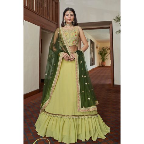 About Product :- Make a shiny statement adorning this ready made fresh yellow colored chiffon lehenga crafted with thread and mirror embroidery all over. Paired along with a matching colored silk & net choli and a fresh Green colored dupatta, both in similar work embroidery .

Lehenga Choli Fabric:-

Lehenga Fabric:-

Blouse Fabric:-Titan Silk
Dupatta Fabric:- Butterfly Net
Work : Embroidery
Size : Semi Stitched Up To 44
Occasion: Sangeet, Festive, Wedding, Engagement Light Green Lehenga, Green Lehenga Choli, Lehenga Choli Designs, Bollywood Lehenga, Green Lehenga, Blue Lehenga, Lehenga Online, Salwar Kamiz, Lehenga Choli Online