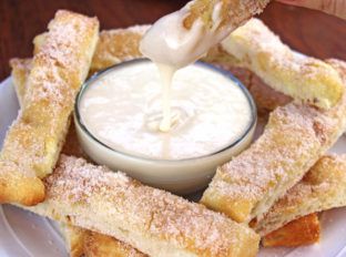 Sweet Cinnamon Stix (Pizza Sticks) like the ones from Domino's... but better because of real butter! and sweet vanilla dipping sauce make pizza night at home feel like you ordered out. Copycat Dominos Cinnamon Twists, Pizza Night At Home, Homemade Pizza Dough Easy, Pizza Sticks, Dinner Then Dessert, Restaurant Copycat, Cinnamon Twists, Bread Sticks, Honey Walnut Shrimp