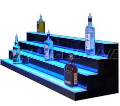 https://encrypted-tbn0.gstatic.com/images?q=tbn:ANd9GcQ4zfsySfW5sMAJiMSSZyi-9LQtEaGoD6FBBg&usqp=CAU Bottle Shelves, Bottle Glorifier, Liquor Display, Bar Deco, Liquor Shelf, Sofa Bar, Bar Dimensions, Bar Shelves, Nightclub Design