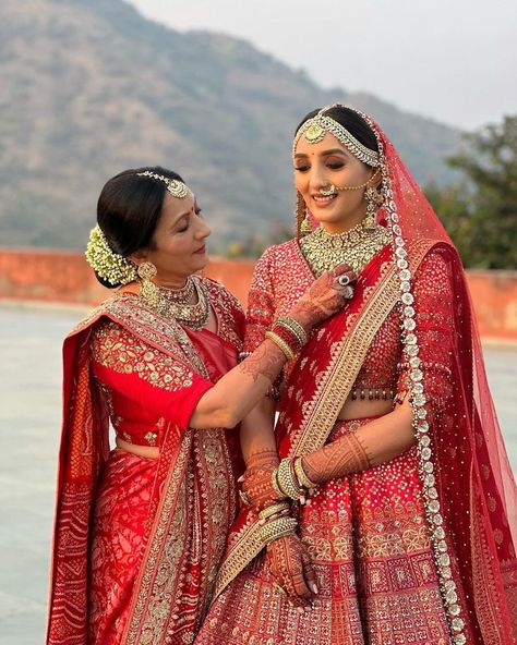 We are crushing over these Bride & Mother Color Coordinating Outfits for Weddings.Coordinating in Pink Lehengas or coordianting in same sarees, this outfits are must seen. #shaadisaga #indianwedding #colorcoordinatingoutfits #brideandmothercolorcoordinatinglehenga #daughterandmothercoordinatedoutfits #daughterandmothercolorcoordinatedoutfits #brideandmotherpictures #brideandmotherpicturesindian #brideandmotherphotos #brideandmotherindian #brideandmotherpicturephotoideas #brideandmotherphotoshoot Brides Mother Indian Outfit, Colour Coordinated Outfits, Nur Jahan, Outfits For Wedding, Brides Mom Dress, Lehenga Ideas, Mother Daughter Poses, Red Bridal Lehenga, Coordinated Outfits