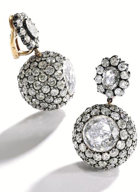 PAIR OF SILVER-TOPPED-GOLD AND DIAMOND BALL EARCLIPS, CIRCA 1860 The tops centered by two oval-shaped diamonds weighing approximately 2.40 carats, suspending spherical drops centered by two table-cut diamonds measuring approximately 13.5 by 13.6 mm and 14.6 by 13.5 mm, accented throughout with numerous old mine and old European-cut diamonds weighing approximately 38.00 carats, with French assay marks; earclip backs of modern design. Diamond Ball, Garnet And Diamond Ring, Jeweled Earrings, Royal Jewels, Silver Tops, Victorian Jewelry, Amethyst Necklace, Vintage Jewels, Van Cleef