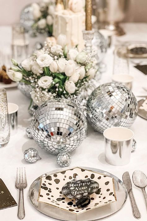 Take in the splendor of this spectacular New Year's Eve revelry! The table settings are so cool! See more party ideas and share yours at CatchMyParty.com New Year Party Centerpieces, New Years Centerpiece Ideas, Nye Table Setting, Disco Ball Table, Best Party Themes, New Years Eve Table, Nye 2025, Party Themes For Adults, New Years Eve Party Ideas Decorations