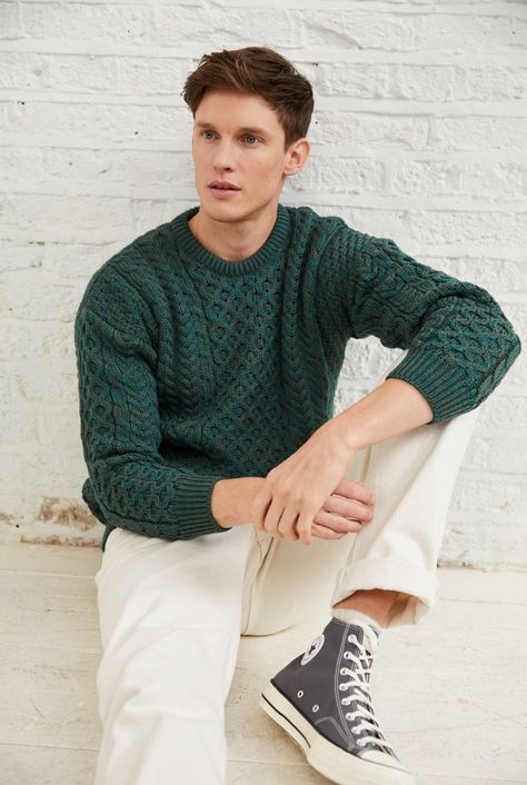 A symbol of Ireland past and present, the Inisheer Traditional Aran Sweater is a timeless addition to your wardrobe. Made with 100% Merino wool, the quality of this authentic Irish gem cannot be rivalled. It is a true Irish hero Aran piece.   Much like its namesake, the Inisheer Aran Sweater captures the essence of Ireland in all of its glory. With a beautiful combination of traditional Aran stitches such as honeycomb, moss and cable, this piece is inspired by the past while remaining firmly roo Forest Green Outfit Men, Mens Fashion Pastel, Christmas Outfits Aesthetic Men, Green Men Aesthetic, Jewel Tone Outfits Men, Christmas Sweater Outfit Men, Green Aesthetic Outfit Men, Men’s Christmas Outfit, Male Christmas Outfit