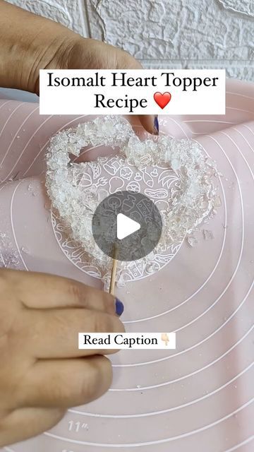 Pooja Chimurkar Ninawe on Instagram: "Isomalt Heart Topper Recipe 👇🏻 ✨Melt isomalt on gas. Once melt completely spread on silicon sheet wait for 4-5 min. And then it will set . Break into small pieces. ✨Again melt some isomalt and then spread in heart shape and add pieces over it , do this action fast bcoz isomalt set so fast. Also put toothpick so that we can hold topper on cake... ✨Apply golden dust at the corner and red and pink colour in centre part as shown in video. ✅Then use on cake as you want. #heart #heartcake #heartrecipe #isomaltheart #cakereels #cakevideo" Cake With Hearts Decoration, Isomalt Cake Topper, Isomalt Cake, Heart Cake Decoration, Heart Cake Topper, Cake Topper Tutorial, Heart Shaped Cakes, Heart Food, Wedding Cake Decorations