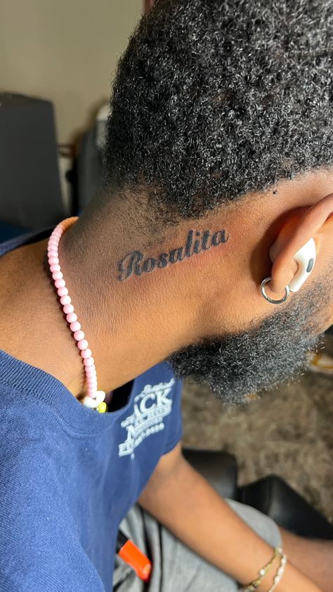 Name Tattoos On Neck Men, Name Tatted On Neck, Neck Tattoo For Guys Name, Tattoo Name On Neck, Name Tattoos Behind Ear Men, Neck Tattoos For Men Words, Name Back Tattoos For Men, Boy Name Tattoos For Women, Man Name Tattoo