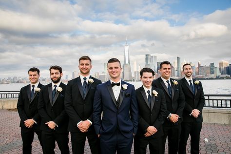 Groom Navy Tux Groomsmen Black, Groomsmen Attire Black And Blue, Navy Blue And Black Groomsmen Suits, Deep Blue Tuxedo Wedding, Navy And Black Tuxedo, Black Bridesmaid Dresses Navy Groomsmen, Midnight Blue Tuxedo Wedding Groomsmen, Navy Black And Gold Wedding, Navy Groom Black Groomsmen