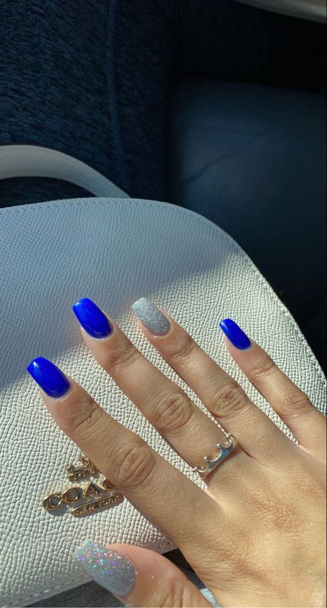 Nails For A Royal Blue Prom Dress, Royal Blue Nails With Silver Glitter, Royal Blue Nails With Accent Nail, Royal Blue Acrylic Nails With Silver, Royal Blue And Glitter Nails, Cute Royal Blue Nails For Prom, Cute Acrylic Nail Designs Purple, Pretty Royal Blue Nails, Homecoming Nails Blue Dress