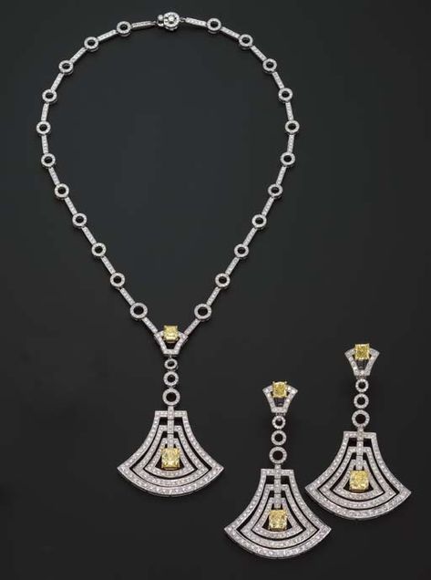 A DIAMOND PENDENT NECKLACE AND EARRINGS, BY GRAFF   The openwork diamond bell pendant with a central radiant-cut fancy intense yellow diamond and surmount weighing 2.16 and 1.03 carats respectively, to the bar and circle link chain, matching ear pendants en suite, mounted in 18k white gold  Earrings signed Graff, no. 4974 Graff Jewelry, Graff Diamonds, Diamond Pendent, Beautiful Gold Necklaces, Yellow Diamonds, Diamond Necklace Set, Diamond Jewelry Necklace, Bell Pendant, Pendent Necklace