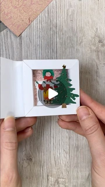 Katharina Tarta on Instagram: "Another shadow box idea, this time with a Christmas theme 😊 And the best thing: You can built up any scene you want in there 😊 A snowy landscape, a pile of gifts, carol singer? What ever you like and gets you in a Christmas mood 😉 Anyway, hope you like this little paper Christmas idea 😊 Ad: The beautiful design paper is from @raindroplila The one I used here just reminded me of a tapestry in a super cosy family home at Christmas, so I just had to use it this way 😊 #christmascrafts #christmascard #papercrafts" Christmas Shadow Box Ideas, Cosy Family Home, Shadow Box Christmas, Christmas Shadow Boxes, Children Crafts, Christmas Craft Fair, Matchbox Art, Snowy Landscape, Christmas Idea