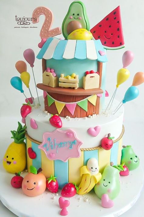 A fruit themed two tier cake for a 2nd birthday party.