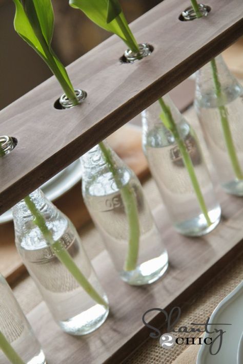 DIY Bottle Vase ( I've begun staining my boards in preparation and have been collecting Mexican coke bottles for weeks ) Bottle Vase Centerpiece, Mexican Coke, Glass Bottle Diy, Bottle Craft, Bottle Decor, Wine Bottle Diy Crafts, Glass Bottle Crafts, Coke Bottle, Wood Vase