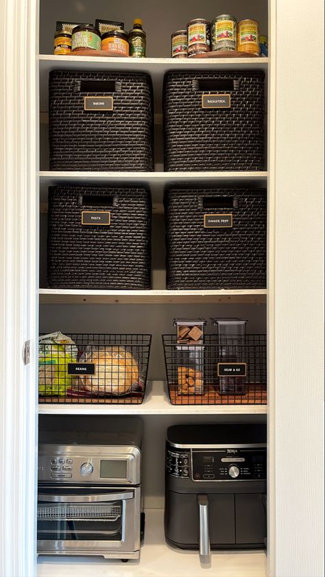 The tailored pantry trio - container store lazy susans, marie kondo wicker baskets, neat method acacia and black metal bins. Shout out to ninja air fryer and cuisinart toaster oven for a chic small appliance design. Kitchen Cabinet Baskets, Pantry Organization Appliances, Storing Appliances In Pantry, Black Pantry Organization, Pantry Basket Organization, Closet Pantry Organization, Wicker Basket Diy, Cuisinart Toaster Oven, Cuisinart Toaster