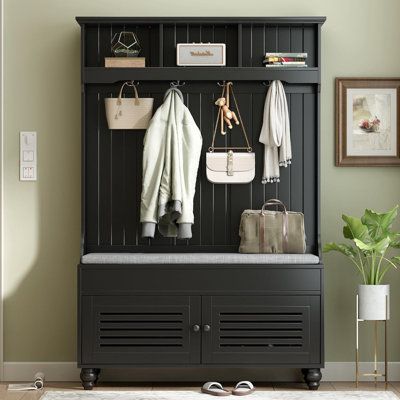 This entryway bench with seat cushion features many storage capabilities to organize and showcase your belongs - including a 2-door cabinet for shoes, a lift-top shallow compartment, 4 double-prong metal hooks to hang coat, scarves, gloves and alike, and 3 open cubby at the top. Color: Black | Rubbermaid Hall Tree w / Bench & Shoe Storage Wood in Black | 69.1 H x 47.2 W x 17.5 D in | Wayfair Hall Tree With Storage, Comfy Seating, Small Space Storage, Cubby Storage, Bench With Shoe Storage, Hall Tree, Entryway Furniture, Large Drawers, Particle Board