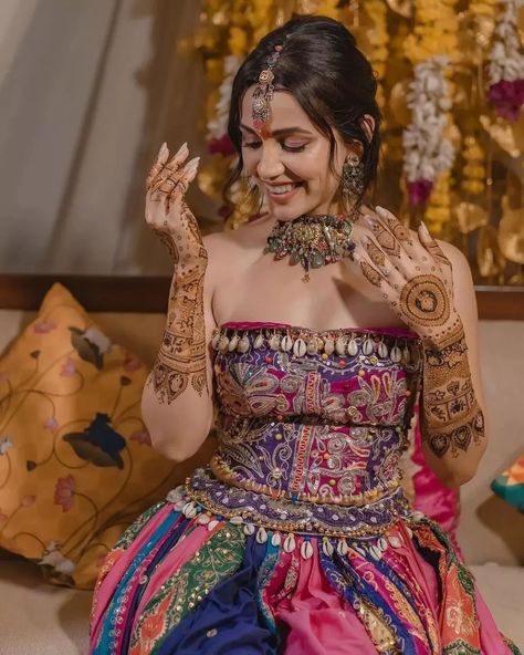 Swooning over Esha Kansara’s enchanting mehendi look! 🌟 Her vibrant multicolored lehenga paired with stunning jewelry creates pure magic. Swipe to be inspired by this mesmerizing style! 💚 . . Couple: Esha Kansara & Siddharth Amit Bhavsar⁠ Outfit by: @annu_patel1402 , annus_creation⁠ Jewellery: @aesha.desaii , @tamraa.bespokejewelry⁠ Mehndi: @jayshreebridalmehandi⁠ Photographer: @karmaproduction_india⁠ Hair: @_hair.by.freya_⁠ Makeup: @theglitterboxbyshreyapatel⁠ Event managed by: @anc_events ... Multicolored Lehenga, Esha Kansara, Mehendi Look, Mehendi Outfit, Simple Lehenga, Mehendi Outfits, Bride Pictures, Style Couple, Bridal Outfit