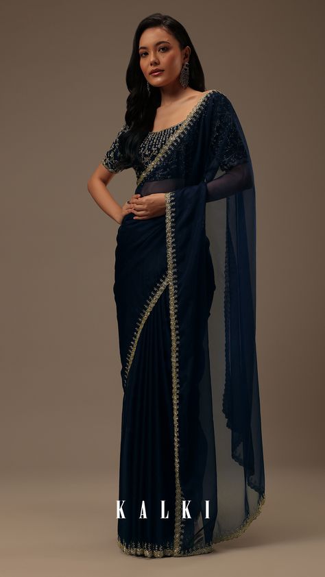 "Introducing our enchanting dark blue plain organza saree, a celebration of simplicity and opulent detailing. This saree showcases a cutdana border that adds a touch of elegance. The unstitched blouse fabric features heavy cutdana work all over. EVENT - Perfect for evening parties. The saree comes with a matching unstitched blouse." Dark Blue Saree Blouse Combination, Malayalam Saree, Dark Saree, Peacock Blue Saree, Dark Blue Saree, Plain Saree With Heavy Blouse, Dark Blue Plain, Saree Plain, Farewell Sarees