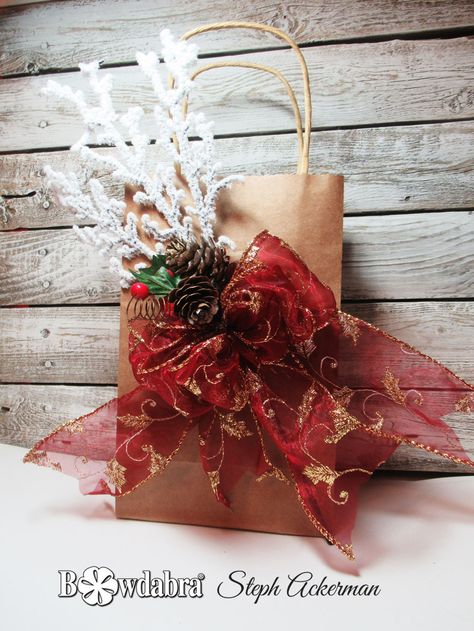 Hi everyone, Steph Ackerman is here to share how to decorate a holiday gift bag with Bowdabra. How To Decorate Gift Bags, Bows For Gift Bags, Holiday Bags, Bow Making Tutorials, Decorated Gift Bags, Holiday Gift Bag, Holiday Bag, Bow Making, Pretty Christmas