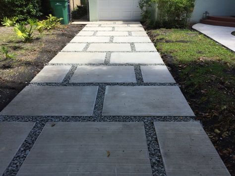 Concrete paver staggered squares design. With 1" gray granite rocks. Staggered Paver Walkway, Pavement Ideas Walkways, Gray Paver Walkway, Square Paver Walkway, Concrete Squares With Rock Between, Staggered Pavers, Concrete Pathway Ideas, Pavers With Rocks In Between, Walkway Pavers Ideas