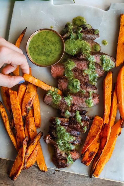 Tender, grilled flank steak drizzled with chimichurri sauce with a side of crispy sweet potato fries! Cilantro Chimichurri, Blue Cheese Stuffed Olives, Chimichurri Steak, Baked Coconut Shrimp, Crispy Sweet Potato Fries, Crispy Sweet Potato, Grilled Flank Steak, Dream Food, Steak Frites