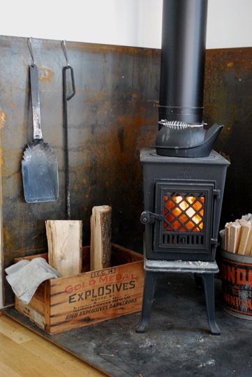 Ann & Dabney’s Splendid Blended Storefront Conversion | Apartment Therapy Wood Stove Surround, Apartment Therapy House Tours, Wood Stove Hearth, Wood Heat, Wood Stove Fireplace, Welding Table, Rocket Stoves, Deco Luminaire, Pellet Stove