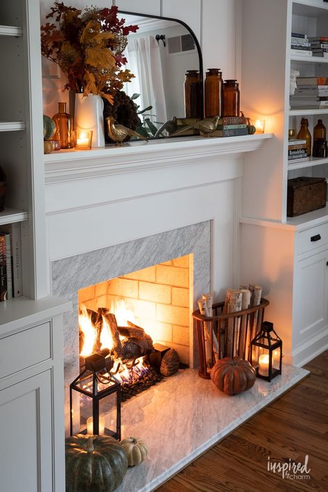 Discover the secret to a cozy, inviting living room this fall! With a mix of vintage charm and natural elements, these fall mantel decor ideas are not just about aesthetics, but about evoking feelings of warmth, nostalgia, and gratitude. #fall #mantel #decor #ideas #falldecor #decorating #manteldecor #autumn #ideas #cozy Fireplace Bookshelf Decorating Ideas, Decorating Living Room Built Ins, Fireplace Mantle With Bookshelves, Fireplace Built Ins Styling, Fireplace Ideas Shelves, Asymmetrical Living Room Built Ins, Fireplace Flush With Wall Shelves, Fireplace Mantle And Shelves, Fireplace Mantle And Built Ins