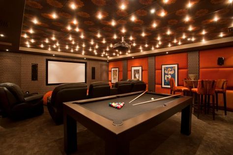 Warm, Inviting Home Theater and Game Room | HGTV Games Room Ideas, Garage Games, Garage Game Rooms, Basement Home Theater, Basement Lighting, Video Game Rooms, Basement Ceiling, Home Theater Rooms, Orange Walls