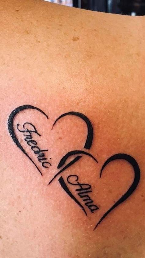 Small Double Heart Tattoos For Women, Family Tattoos With Names, Hearts With Names Tattoos, Grand Kids Tattoo Ideas, 2 Heart Tattoo Designs, Heart Tattoo Designs With Names, Tattoo Of Kids Names For Women, Two Kids Tattoo Ideas, Grandson Tattoos For Grandma