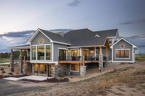 Rear-right view with a partially covered deck and a walkout basement. 5 Bedroom Walkout Basement House Plans, 4 Bedroom 2.5 Bath Floor Plan, Daylight Basement House Plans, Mountain Farmhouse, Country Farmhouse Plans, 1st House, Wraparound Porch, Nice Homes, Basement House Plans