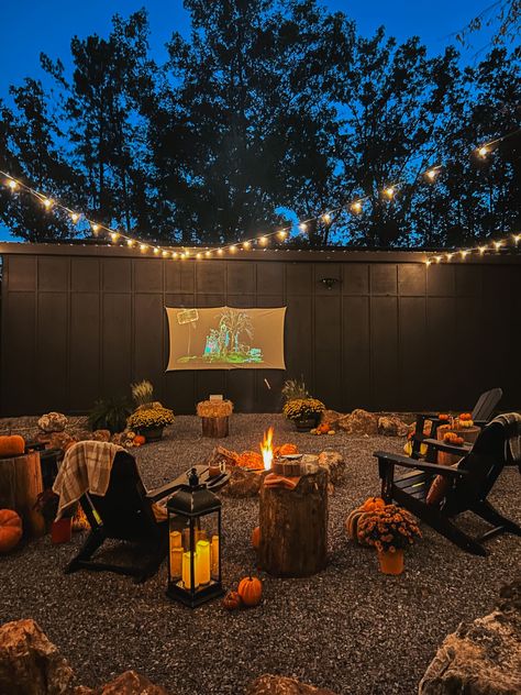 We recently added an awesome fire pit area to the side of our barn. It is a great space to hang out under the trees and twinkle lights and watch a movie on the projector screen. As you know, Fall i… Fall Fire Pit, Fire Pit Yard, The Projector, Old Time Pottery, Ghost Diy, Halloween Front Porch, Fire Pit Area, Pumpkin Pillows, Projector Screen