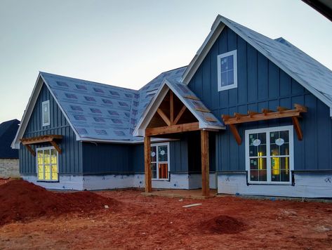 Navy Blue Board And Batten Exterior, Dark Blue Board And Batten Siding, Blue Vertical Siding, Blue Board And Batten Exterior, Cedar Accents On House Exterior, Cedar Cabin, Corrugated Metal Siding, Blue Siding, Split Foyer