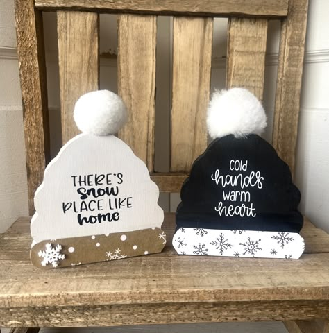 Country farmhouse hats for tiered trays, shelf or anywhere. Make a great Mateo accent for winter and Christmas. Holiday stocking stuffer.  Wood scrunchy Pom Pom hat choice: Black snowflake says " cold hands warm heart ",  Tan says "there's snow place like home " with snowflake accent.  5 high by 4 wide  Thanks for stopping by.  If you are purchasing multiple items I am happy to set up a custom listing to save you on shipping.  Please note that farmhouse decor is not perfect, there are sometimes Winter Signs And Sayings, Diy Winter Hats, Cowboy Ornaments, Snow Place Like Home, Winter Wood Crafts, Diy Hobbies, Cold Hands Warm Heart, Letter Crafts, Barn Siding