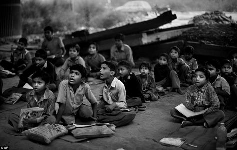 Honourable mention: This photo by Associated Press photographer Altaf Qadrin shows underprivileged Indian children attend a free school run under a metro bridge in New Delhi, India Under Bridge, Humanitarian Projects, Country Photography, Education In India, World Press, Country Kids, New Delhi India, Free Education, Poor Children