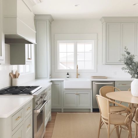 Here's 15 of the most popular greige kitchen cabinet colors to help inspire your kitchen remodel! Grays That Go With Sw Alabaster, French Countryside Paint Colors, Drift Of Mist Sherwin Williams Kitchen, Natural Linen Sherwin Williams Kitchen Cabinets, Benjamin Moore Etiquette, Drift Of Mist Sherwin Williams Cabinets, Drift Of Mist Kitchen Cabinets, Grey Mist Benjamin Moore, Downy Sherwin Williams