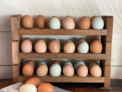 "These stackable egg holders are a great way to store your fresh unwashed eggs on your counter! They are made of cedar wood to last a long time. Each egg holder is hand-crafted with love. Do to the nature of hand-crafted items, no egg holder will be exactly like another and may have minor imperfections. We strive to give each customer a quality item that adds the rustic charm of farm-fresh eggs in their kitchen. If you have any questions about this item, please message us and we would be happy t Counter Egg Storage, Egg Holder Wood, Wood Egg Holder, Wooden Egg Holder, Farmhouse Eggs, Collecting Eggs, Fresh Egg, Harvest Basket, Solid Wood Kitchens