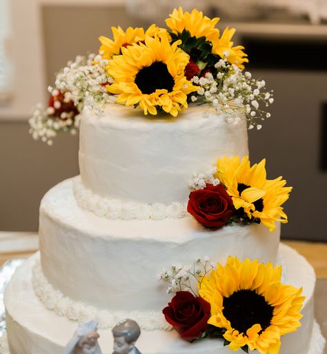 Sunflowers and roses wedding cake I made for my son and his wife ❤️ Wedding Cake Sunflower And Roses, Red And Yellow Wedding Cake, Sunflower Rose Wedding Cake, Sunflower And Roses Wedding Cake, Sunflower And Rose Wedding Cake, Cakes With Sunflowers, Jake 2024, Sunflower And Rose Wedding, Angel Boots