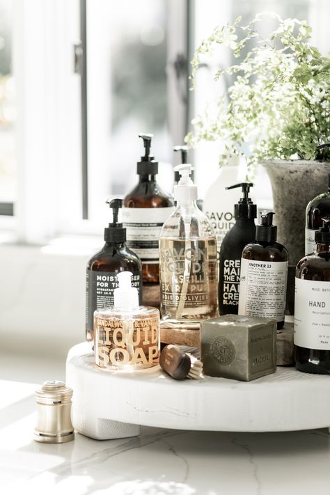 We take washing our hands very seriously in this house! Having a stand next to the sink with all the different soaps and lotions, leaves no excuses for not washing hands! | Styled and Photographed by Public 311 Design | #frenchsoap #decorativesoap #handsoapforthehome #besthandsoaptodecoratewith #bathroomcounterdecor #stylingwithbathroomsoap #handsoapdecorating #savonliquidsoap #lelabosoap 60s Kitchen, Bathroom Counter Decor, Sink Decor, Soap Display, Pretty Soap, Kitchen Soap, Interior Photography, White Bathroom, Bathroom Styling