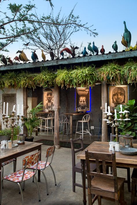 Portraits of people of the Omo River Valley in Ethiopia by acclaimed South African photographer David Ballam are displayed in Milk Bar. The colourful birds on the rooftop are made in the Amatuli workshop. David Ballam, Rustic Restaurant Interior, Interior Design Restaurant, Rooftop Restaurant Design, Interior Restaurant, African Interior Design, Modern Restaurant Design, Portraits Of People, Outdoor Restaurant Design