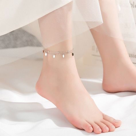 Add a touch of bohemian charm to your jewelry collection with this beautiful anklet from The Silver Luna. Crafted from high-quality 925 sterling silver, this double layer bracelet features a unique bell charms design that is sure to catch the eye. The anklet is perfect for everyday wear or for adding a touch of elegance to your outfit. The bracelet is nickel-free and features a spring ring closure for a secure fit. The silver color of the bracelet complements any outfit, while the bohemian theme adds a touch of personality. Whether you're looking for a unique piece of jewelry or a thoughtful gift, this anklet is sure to impress. Materials: 925 sterling silver Finish: platinum plate Anklet length: 8 in + 1.25 in adjustable chain. Leg Jewelry, Sterling Silver Anklet, Beads Chain, Silver Anklets, Foot Jewelry, Double Chain, Women Legs, Ankle Bracelet, Chain Anklet