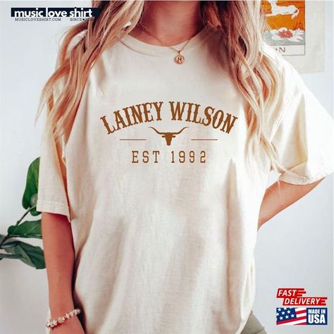 Lainey Wilson Bull Skull T-Shirt Cowboy Country Shirt Music Sweatshirt Check more at https://musicloveshirt.com/product/lainey-wilson-bull-skull-t-shirt-cowboy-country-shirt-music-sweatshirt/ Lainey Wilson Outfits, Laney Wilson, Country Fest, Lainey Wilson, Music Sweatshirts, Fest Outfits, Texas Shirts, Iconic Album Covers, Shirt Designs For Men