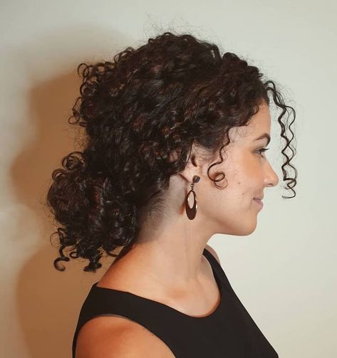 15 Smartest Messy Buns for Curly Hair [2023] Short Curly Hair In Ponytail, Low Updo Curly Hair, Bun In Curly Hair, Curl Messy Bun, Low Messy Bun For Curly Hair, Side Ponytail Hairstyles Curly Hair, Bun Ideas For Curly Hair, Low Bun Wavy Hair, Short Curly Hair Bun Styles